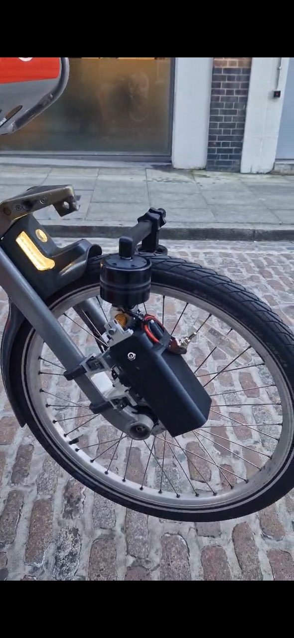 E-bike conversion kit installed on a front wheel